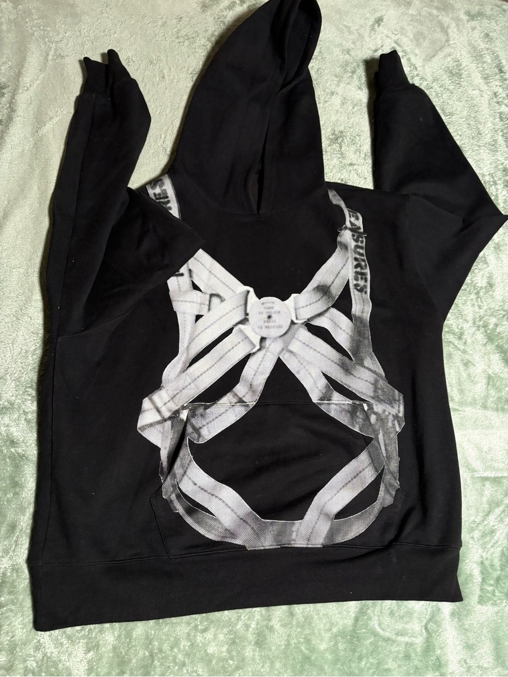 Pleasures Black amens Hoodie with White parachute Harness Graphic